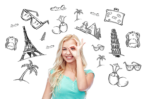 people, tourism, vacation and summer holidays concept - smiling young woman or teenage girl making ok hand gesture over touristic doodles