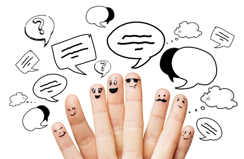 communication, family, people and body parts concept - close up of two hands showing fingers with different facial expressions and text clouds