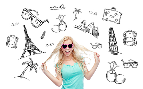 people, tourism, vacation and summer holidays concept - smiling young woman or teenage girl in sunglasses holding her strand of hair over touristic doodles