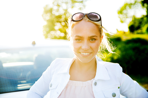 summer vacation, holidays, travel, road trip and people concept - happy smiling teenage girl or young woman near car