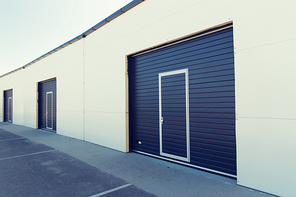 storage, building structure and architecture concept - garage or warehouse exterior