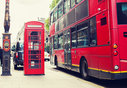 city life and public places concept - red double decker bus and telephone booth on london street