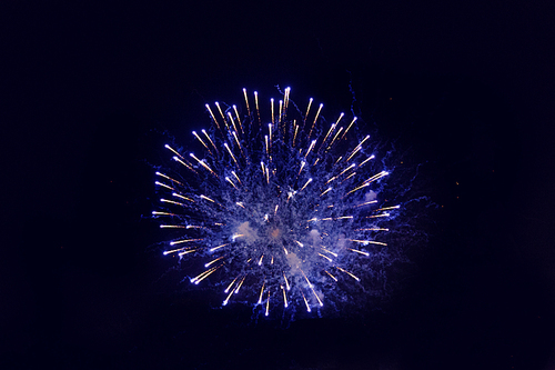 holidays, celebration, party, festival and new year concept - beautiful fireworks at night sky