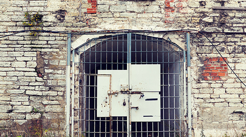 imprisonment, building concept - old prison gate