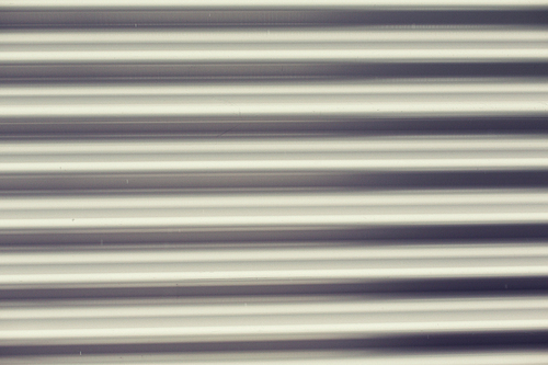 background and texture - close up of aluminum metal garage door backdrop
