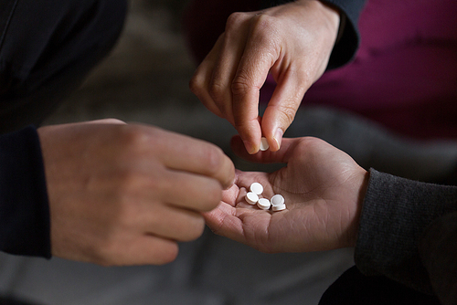 substance abuse, addiction and people concept - close up of addicts using drugs outdoors