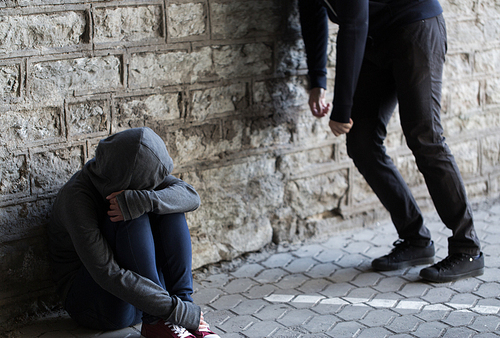 substance abuse, addiction, people and drug use concept - close up of addicts on street