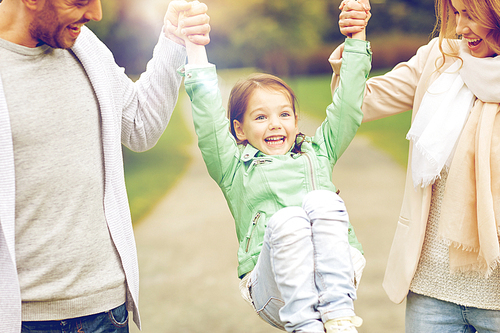 family, happiness, childhood and people concept - close up of happy mother, father and little girl walking in summer park and having fun