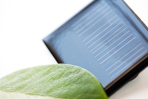 recycling, energy, power, environment and ecology concept - close up of solar battery or cell