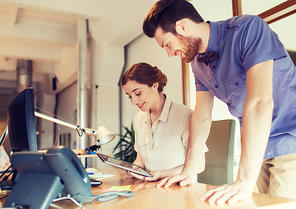 business, startup and people concept - happy creative team with tablet pc computer in office