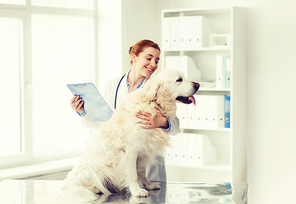 medicine, pet, animals, health care and people concept - happy veterinarian or doctor with golden retriever dog and clipboard at vet clinic