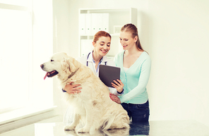medicine, pet, health care, technology and people concept - happy woman with golden retriever dog and veterinarian doctor holding tablet pc computer at vet clinic