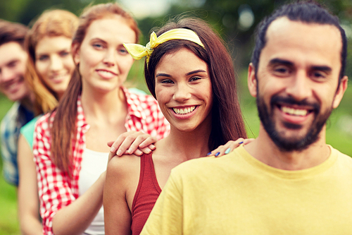 friendship, leisure, summer and people concept - group of smiling friends outdoors