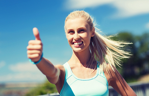 fitness, sport, friendship and healthy lifestyle concept - happy young woman exercising outside