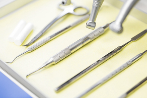 dentistry, medicine, medical equipment and stomatology concept - close up of dental instruments