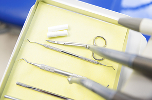 dentistry, medicine, medical equipment and stomatology concept - close up of dental instruments