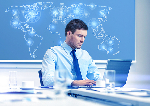 business, people and work concept - businessman with laptop computer and virtual world map sitting in office