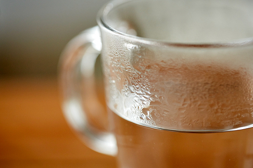 drink concept - close up of glass with hot water