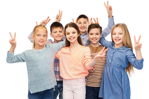 childhood, fashion, friendship and people concept - happy smiling children showing peace hand sign