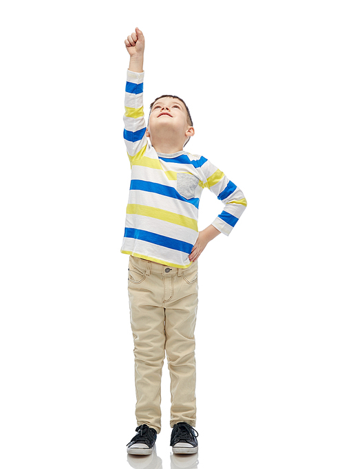 childhood, power, gesture and people concept - happy smiling little boy with raised hand