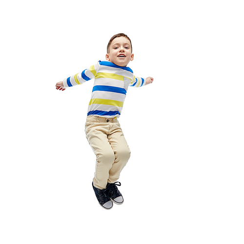 happiness, childhood, freedom, movement and people concept - happy little boy jumping in air