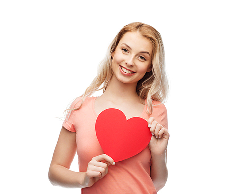 love, romance, charity, valentines day and people concept - smiling young woman or teenage girl with blank red heart shape