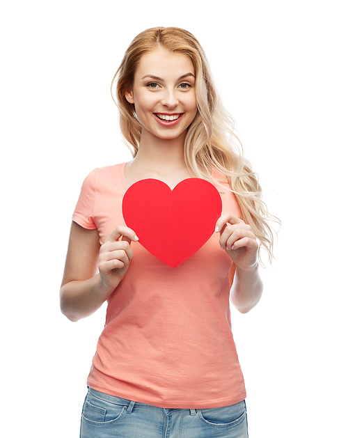 love, romance, charity, valentines day and people concept - smiling young woman or teenage girl with blank red heart shape