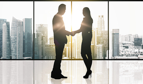 business, teamwork, partnership, cooperation and people concept - partners shaking hands over office window and singapore city skyscrapers background and sun light