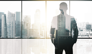 business and people concept - silhouette of businessman over office window and singapore city skyscrapers background and sun light double exposure effect