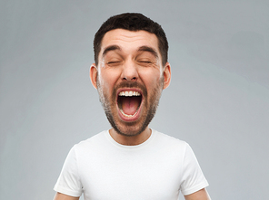 emotions, stress, madness and people concept - crazy shouting man in white t-shirt over gray background (funny cartoon style character with big head)