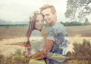 summer holidays, love, romance and people concept - happy smiling young hippie couple hugging over natural background with double exposure effect
