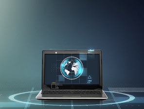 technology and network concept - laptop computer with earth globe on screen over gray background