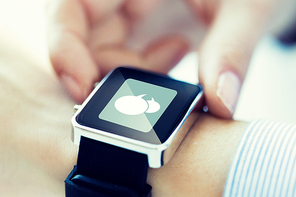 business, technology, communication, connection and people concept - close up of hands with message icon on smartwatch