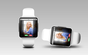 modern technology, communication, object, responsive design and media concept - smart watches with incoming call on screen over gray background