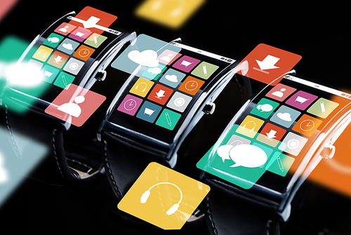 modern technology, object and media concept - close up of black smart watch set with menu icons on screen