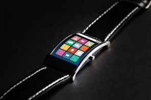 modern technology, object and multimedia concept - close up of black smart watch with menu icons on screen