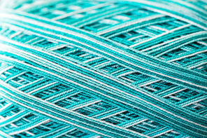 handicraft , knitting and needlework concept - close up of ball of turquoise yarn