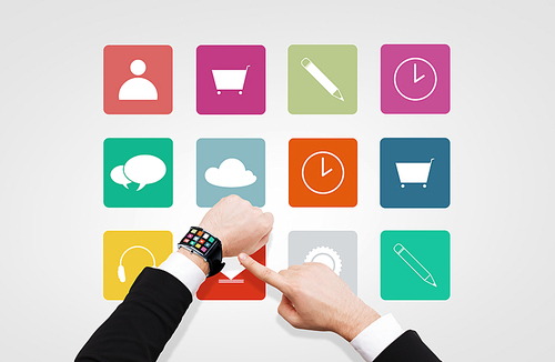 business, multimedia, people and modern technology concept - close up of businessman hand pointing to smart watch with menu icons on screen