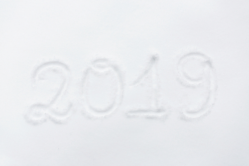 winter holidays and new year concept - calendar number 2019 or date on snow surface