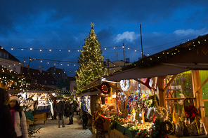 holidays, sale and retail concept - christmas market at old town hall square in tallinn