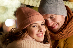 love, romance and people concept - close up of happy couple in winter clothes