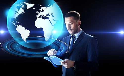 business, people and future technology concept - businessman in suit working with transparent tablet pc and virtual earth hologram computer over black background