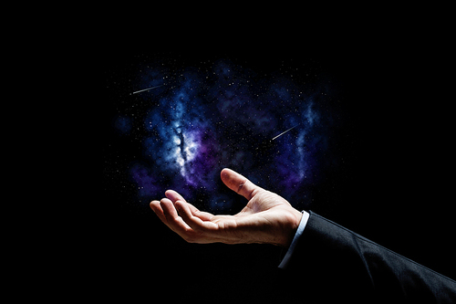 business, people and future concept - close up of businessman hand over space background