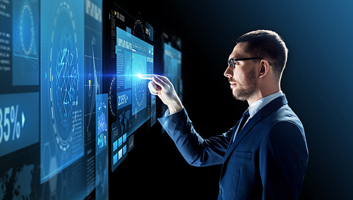 business, people, augmented reality and future technology concept - businessman in glasses with virtual screens projection over black background