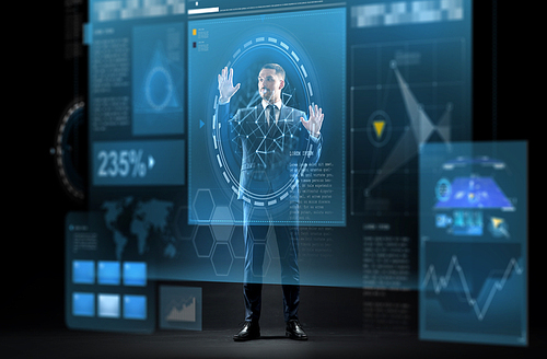 business, augmented reality, people and future technology concept - businessman in suit working with virtual screens projection over black background