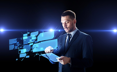 business, people and future technology concept - businessman in suit working with transparent tablet pc computer and virtual screens over black background