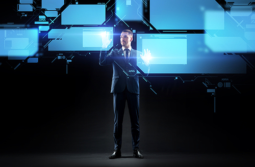 business, people, augmented reality and future technology concept - businessman working with virtual screen over black background