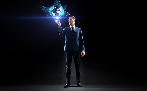 business, people, augmented reality and future technology concept - businessman with virtual earth hologram over black background