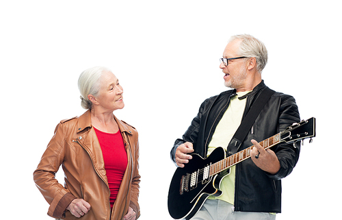 music, age and people concept - happy senior couple with electric guitar