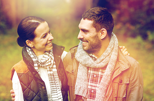 relationships and people concept - happy couple hugging outdoors